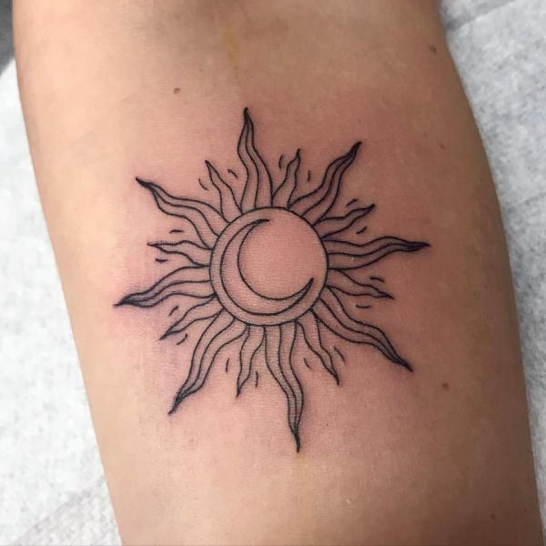 Moon in sun linework tattoo