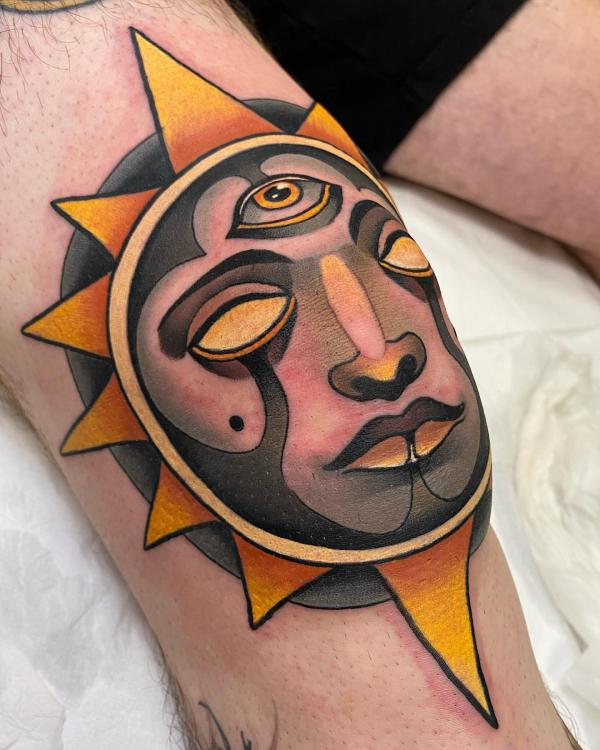 Neo traditional sun with all seeing eye tattoo on knee