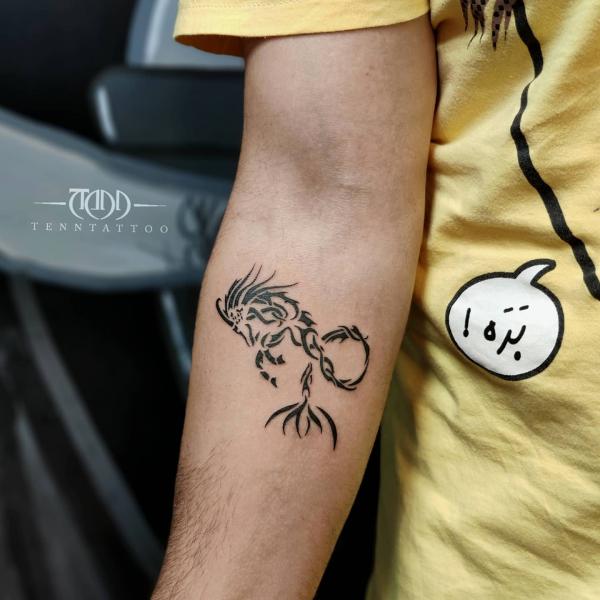 Neo tribal Capricorn sea goat tattoo forearm