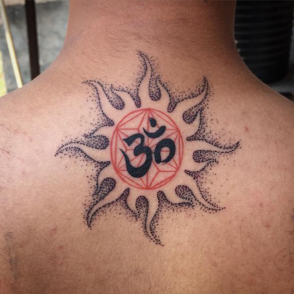 OM and sun tattoo