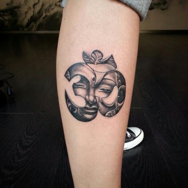 OM buddha tattoo on lower leg