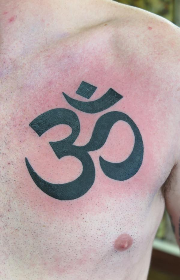 OM chest tattoo