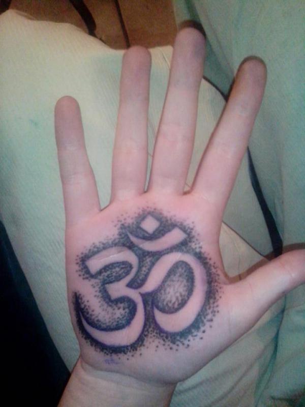 OM palm tattoo