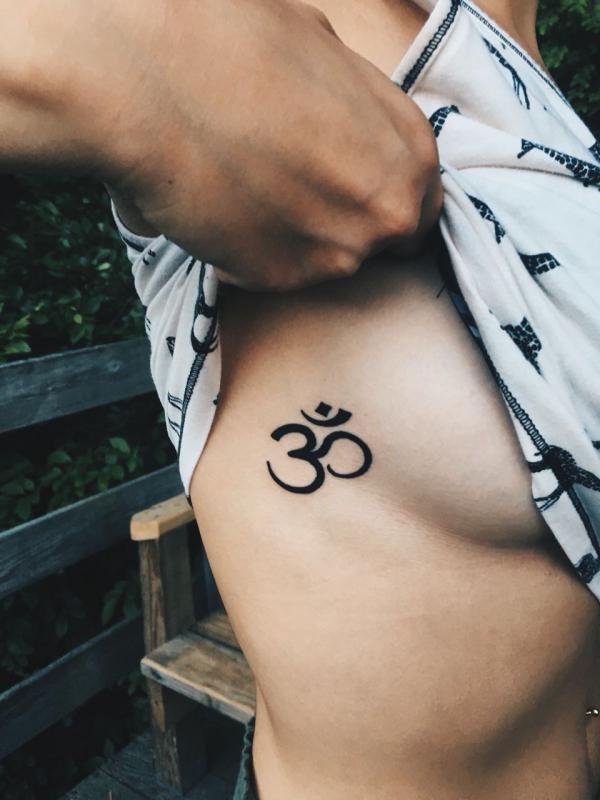 OM side boob tattoo