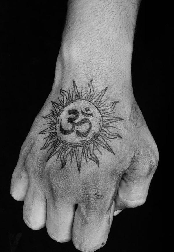 OM sun hand tattoo