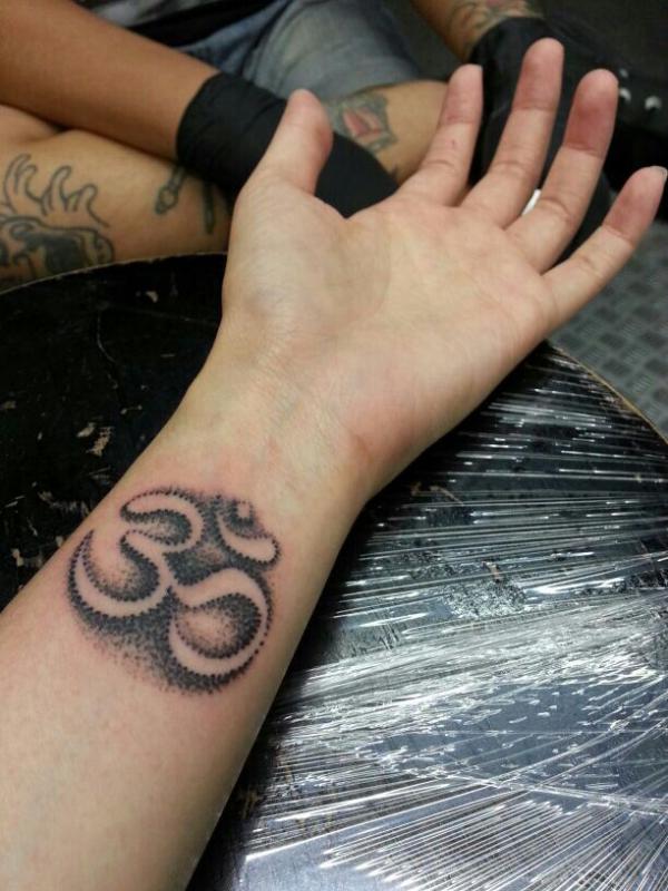 OM tattoo wrist