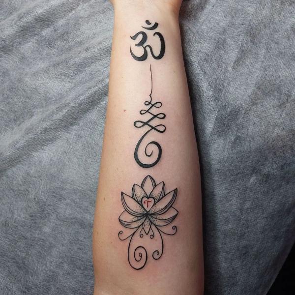 OM unalome and lotus tattoo foreamr