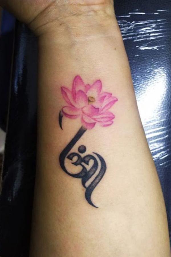 Pink lotus and OM tattoo