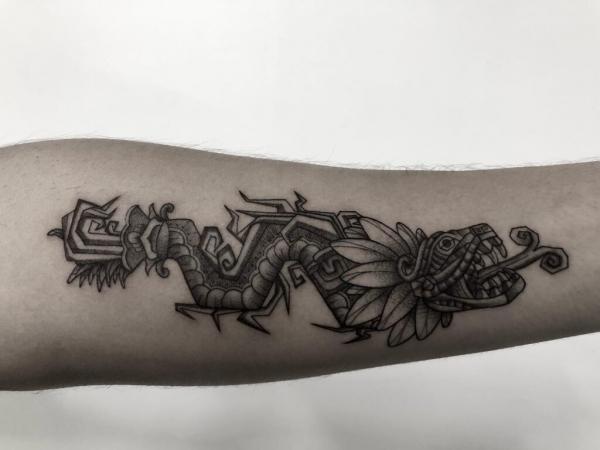 Quetzalcoatl forearm tattoo