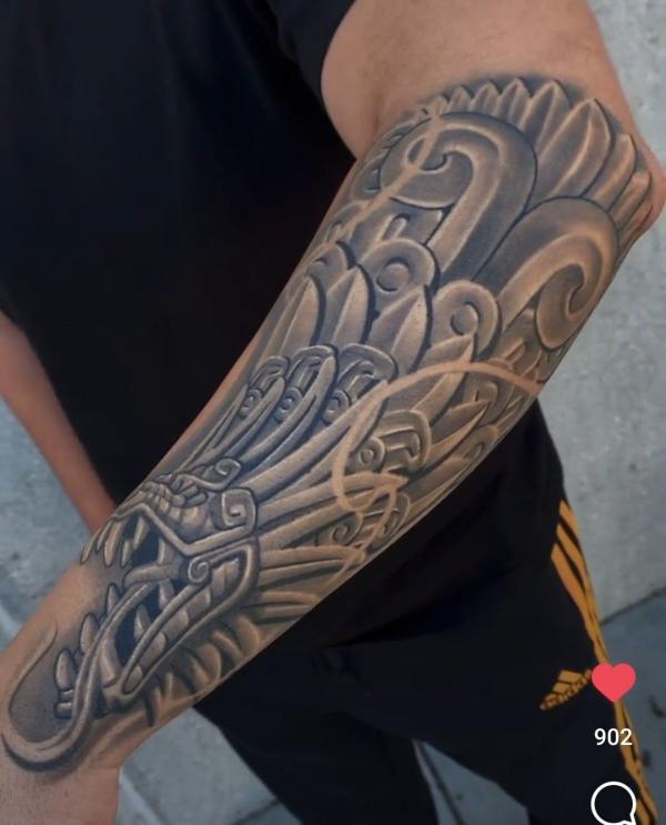 Quetzalcoatl head forearm Tattoo