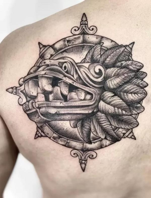 Quetzalcoatl shoulder blade tattoo