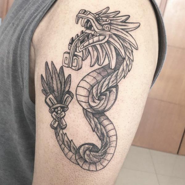Quetzalcoatl upper arm tattoo