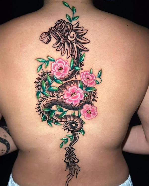 Quetzalcoatl with flowers tattoo back