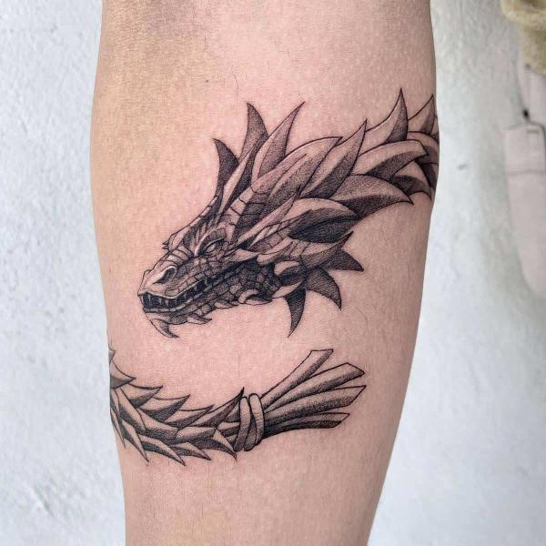 Quetzalcoatl wrapped around forearm tattoo
