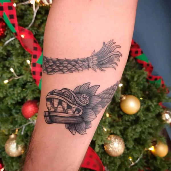 Quetzalcoatl wrapped on forearm tattoo