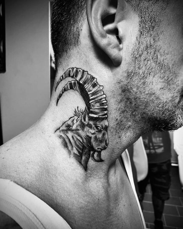 Realistic Capricorn goat neck tattoo for men