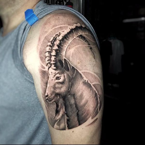Realistic Capricorn head tattoo quarter sleeve