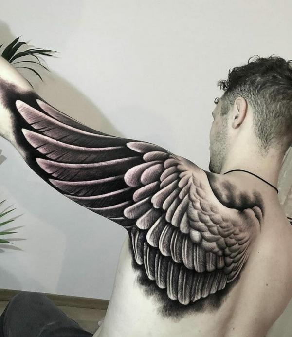 Realistic guardian angel wing tattoo