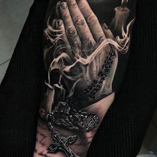 Realistic smoke and praying hands tattoo