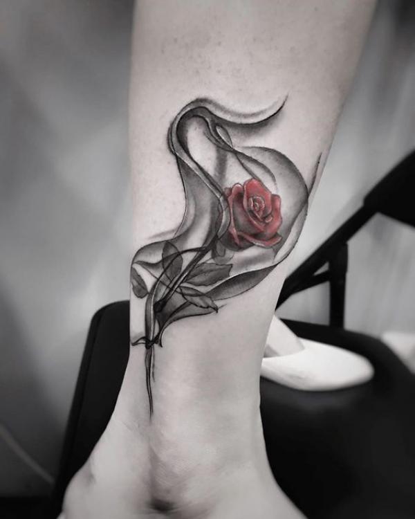 Rose in smoke tattoo