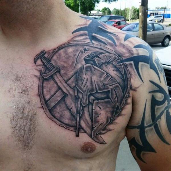 Shield chest tattoo