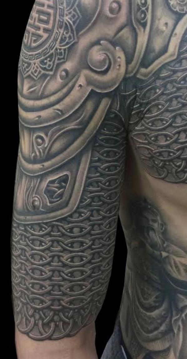 Shield half sleeve tattoo