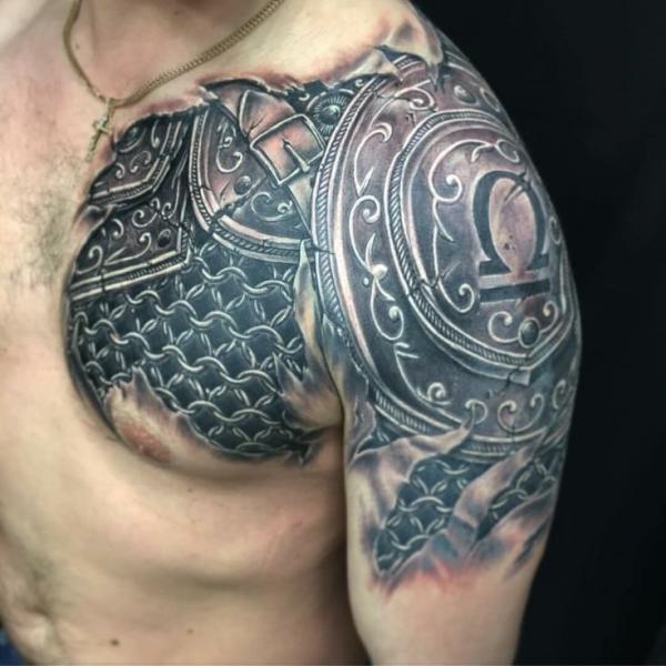 Shield shoulder to chest tattoo