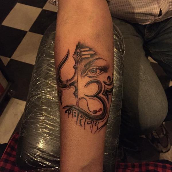 Shiva and trishul with OM tattoo forearm