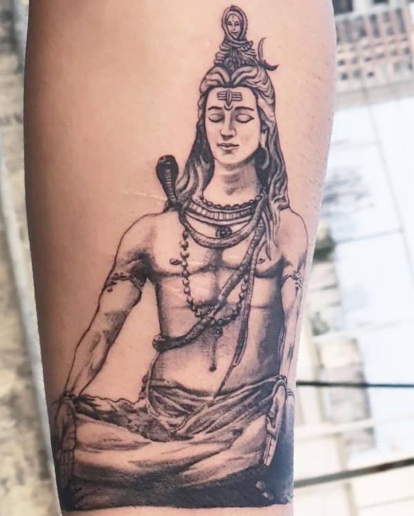 Shiva in meditation tattoo forearm