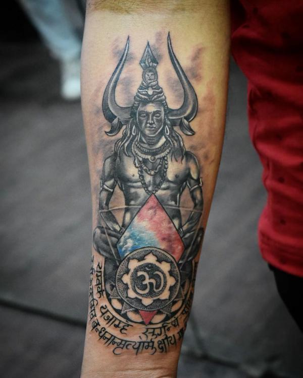 Shiva with OM tattoo forearm