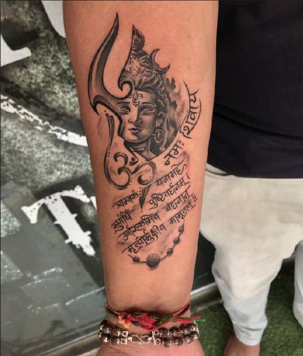 Shiva with mantra tattoo forearm