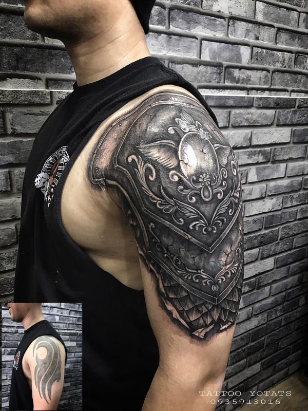 Shoulder to arm shield tattoo