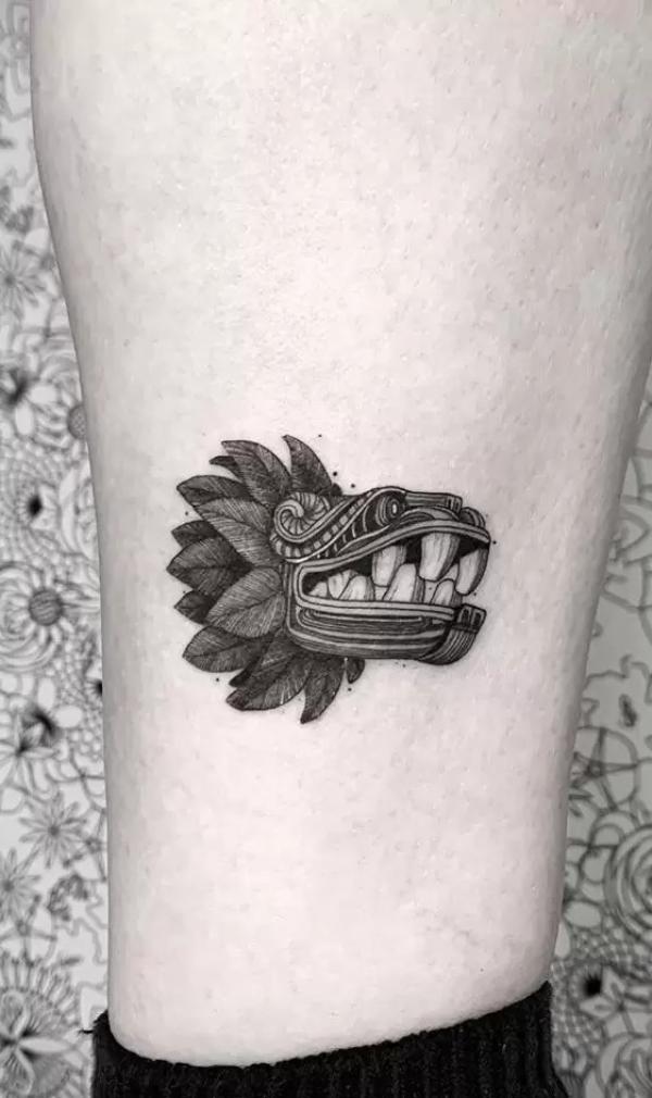 Small Quetzalcoatl tattoo on lower leg