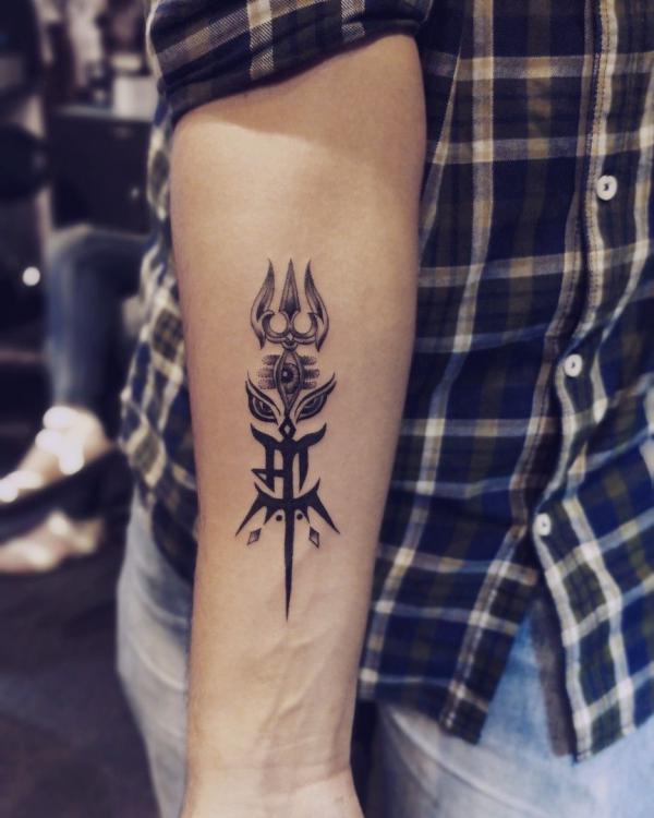 Small Trishul with the third eye tattoo forearm