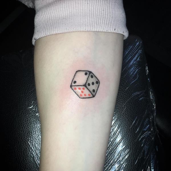 Small dice tattoo forearm