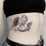 Small kissing cupid tattoo side