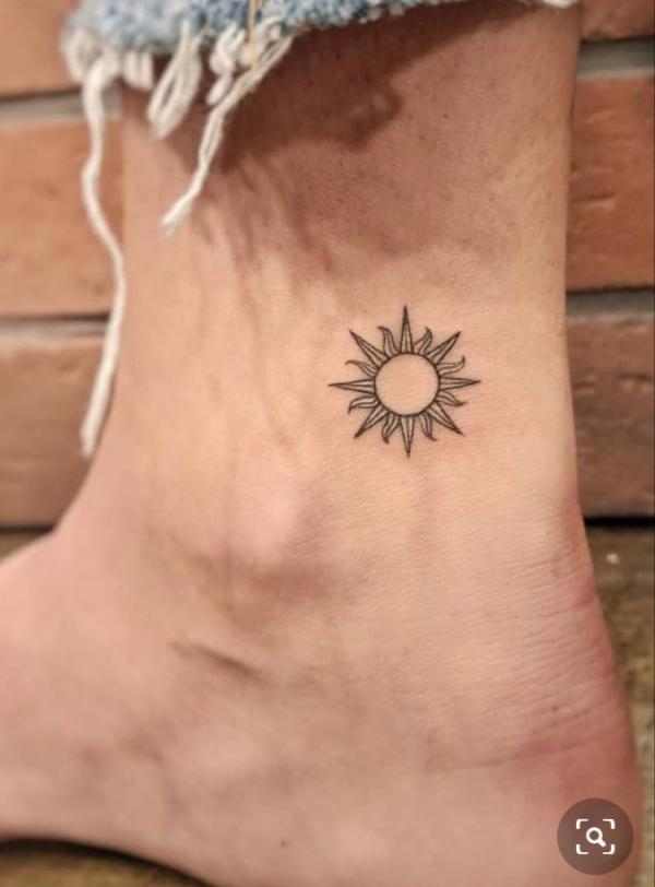 Small sun tattoo ankle