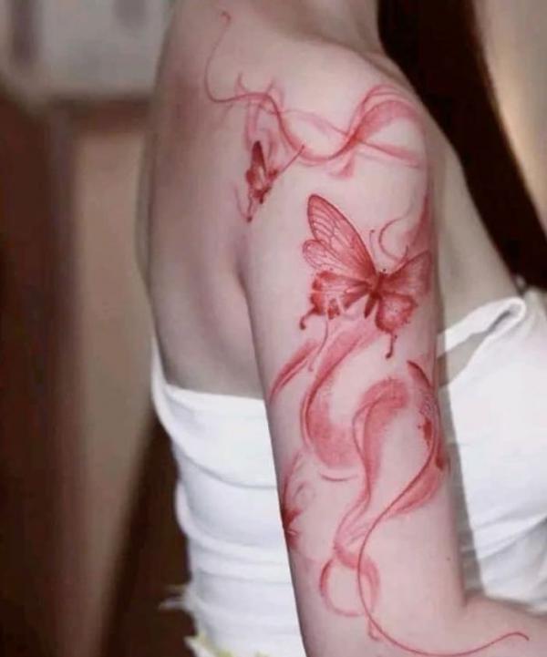 Smoke and butterfly smoke on upper arm