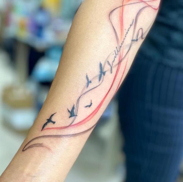 Smoke and flying birds tattoo