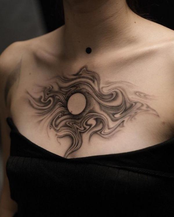 Smoke and sun tattoo chest
