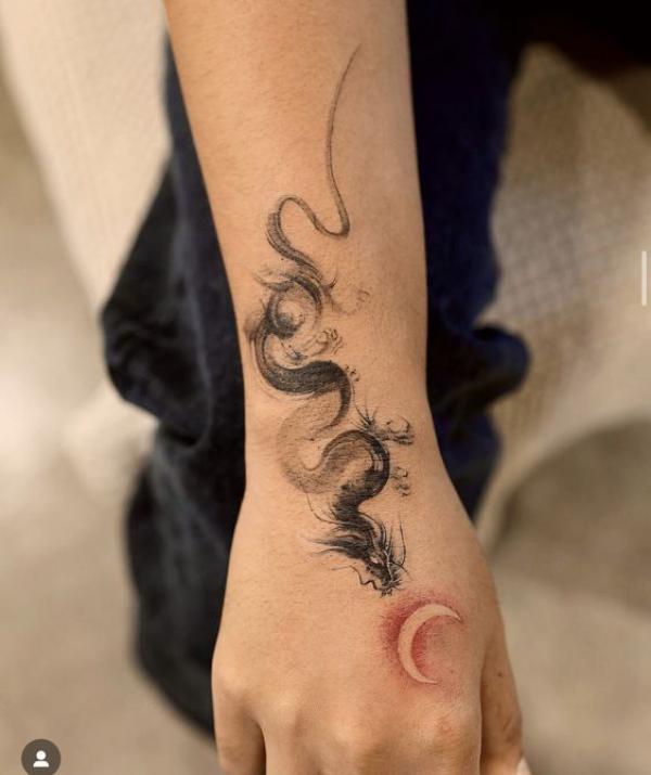 Smoke dragon and cresvent moon tattoo hand
