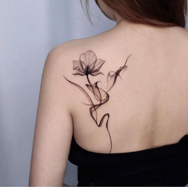 Smoke flower tattoo shoulder blade
