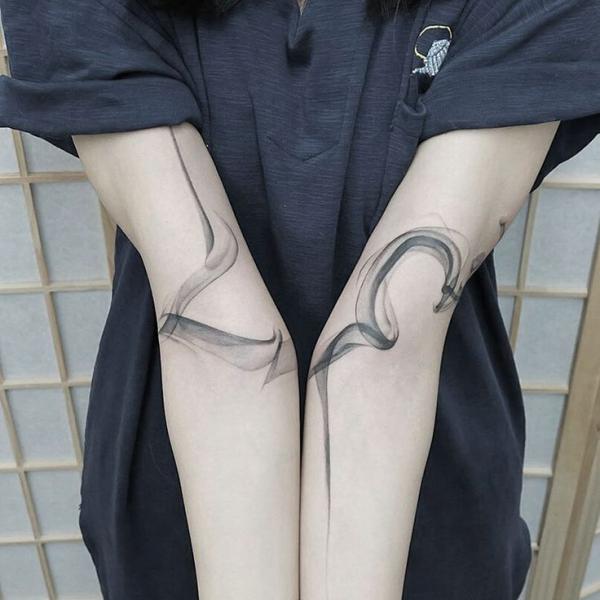 Smoke inner elbow tattoo