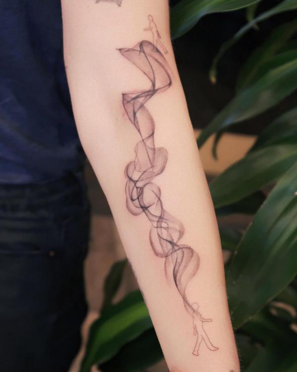 Smoke inner forearm tattoo