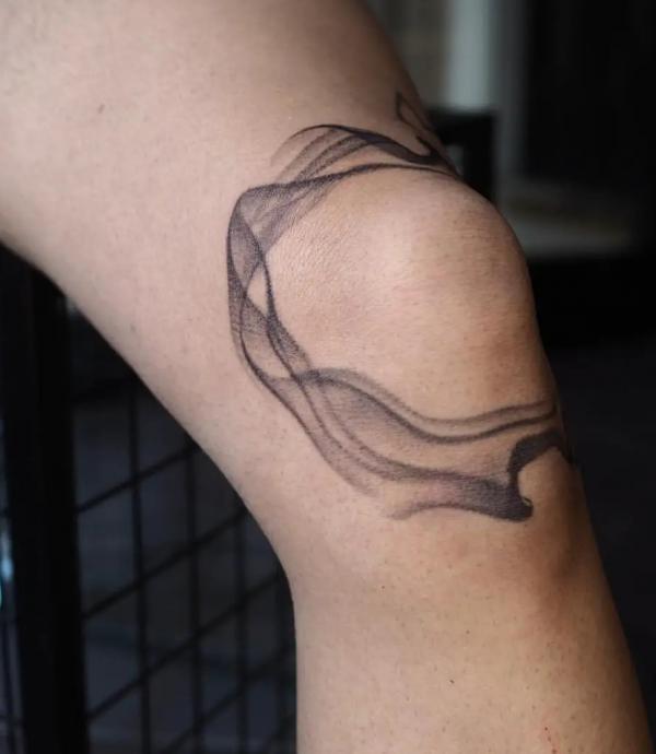 Smoke knee tattoo