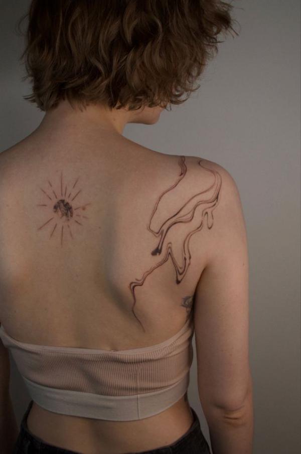 Smoke shoulder blade tattoo