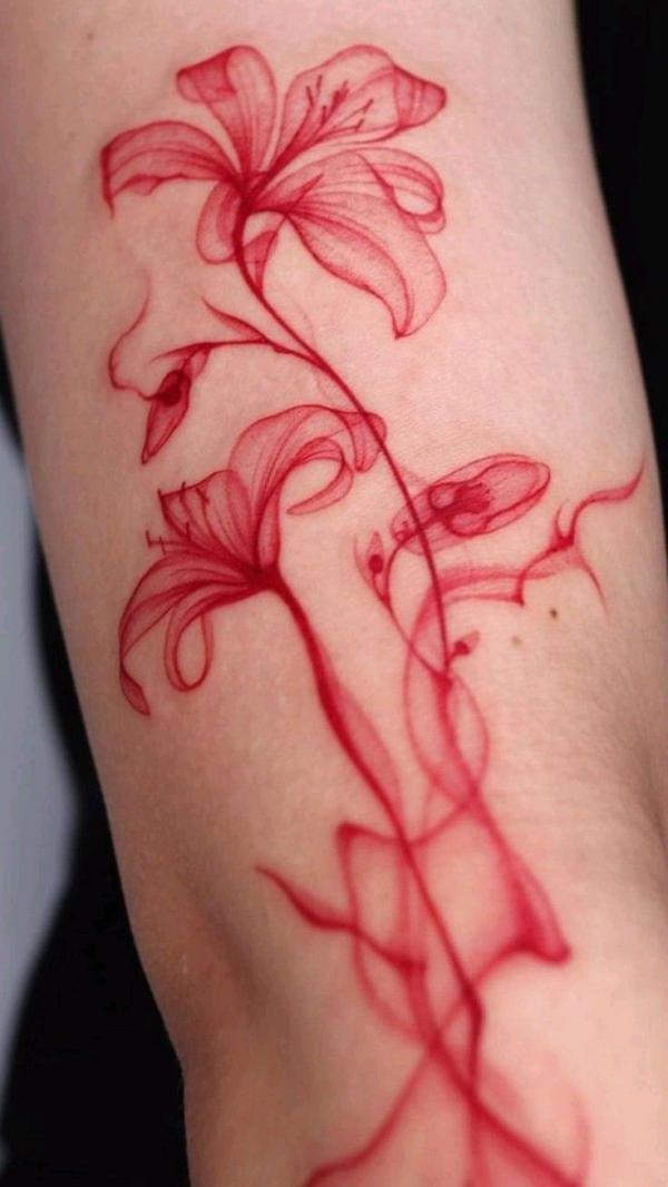 Smoking flower in red tattoo