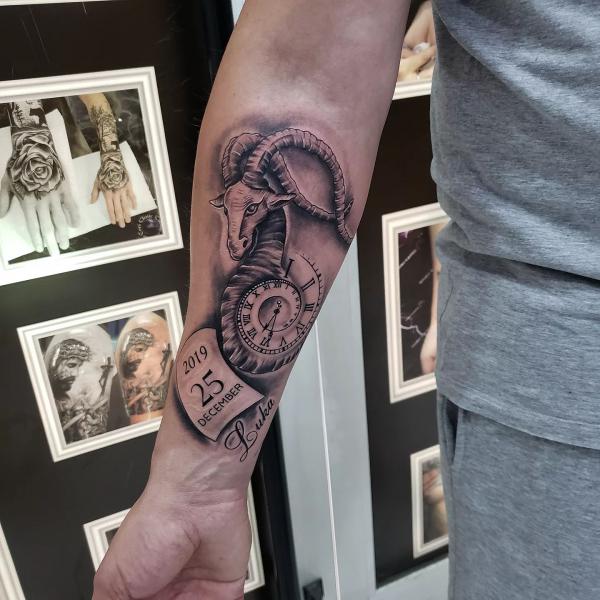 Spiral clock Capricorn goat with date tattoo