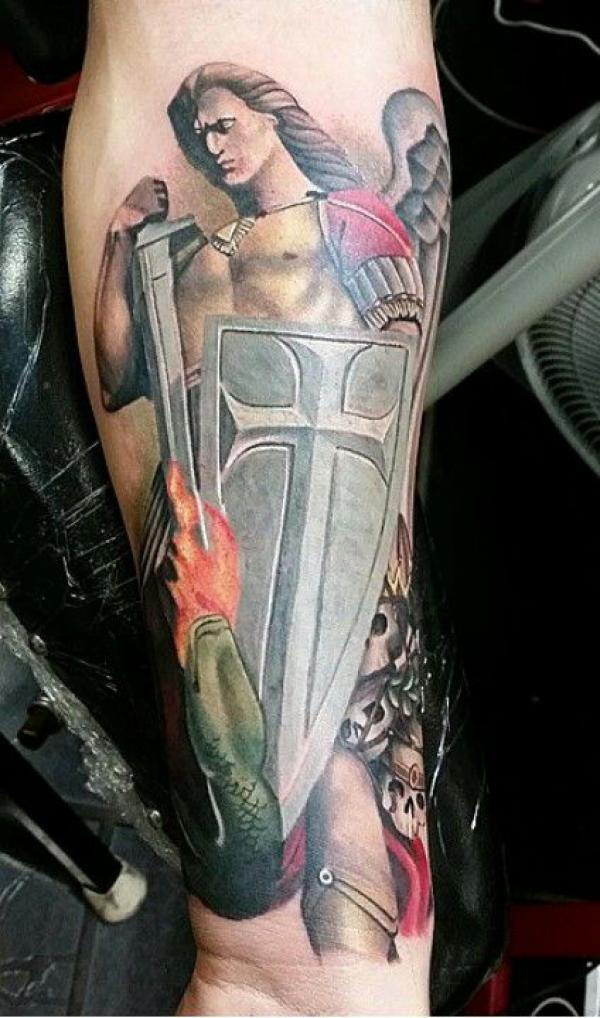 St Michael with sword and shield tattoo forearm