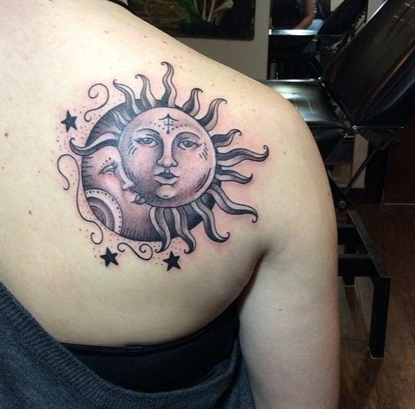 Sun and moon with three stars tattoo shoulder blade